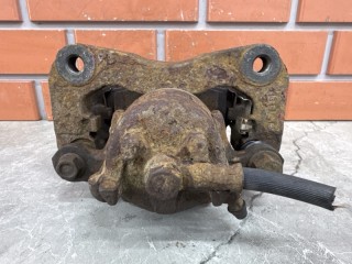 Суппорт передний левый, ориг. номер MR569125, Mitsubishi Lancer Cedia 2000-2003