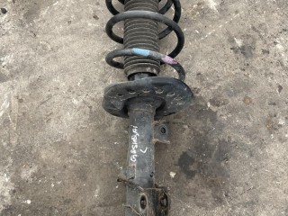 стойка амортизатора передняя левая Nissan Qashqai J10 2006-2010